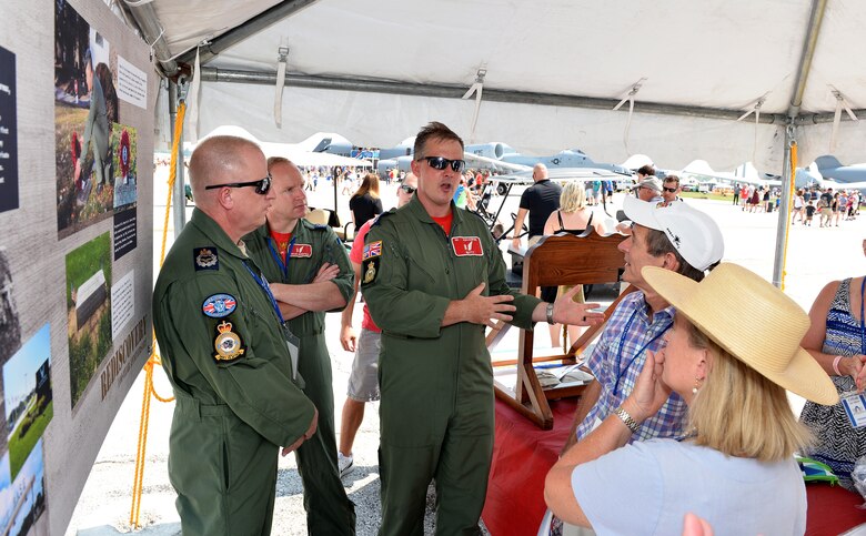 Members of the Royal Air Force speak to members of the Offutt family in the 55th Wing Association’s historical tent during the Defenders of Freedom Air and Space Show on Offutt Air Force Base, Nebraska, Aug. 12, 2018. A ceremony was held during the air show to honor the late Lt. Jarvis Offutt who the base is named after. He was the first Omaha native to die in WWI when his plane was shot down over France 100 years ago. (U.S. Air Force photo by Josh Plueger)(U.S. Air Force photo by Josh Plueger)