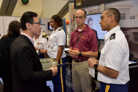 United States Army Recruiting Command’s Command Psychologist, Lt. Col. Joseph H. Afanador and Greg Florey, conventions exhibitor, National Conventions Division speaking with an American Psychological Association 2018 Convention attendee about the benefits of a psychology career in the Army. Afanador and Florey were on hand with members of the San Francisco Medical Recruiting Station to explain the advantages and opportunities of careers in Army Medicine. For more information on the Army's more than 90 medical specialties go to healthcare.goarmy.com.