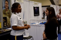 Maj. Lakishia M. Simmons, San Francisco Medical Recruiting Station officer-in-charge, speaks with an attendee of the American Psychological Association 2018 Convention at the Moscone Center in San Francisco, California on August 9. Simmons was on hand with her team to explain the benefits and opportunities of a career in Army Medicine. For more information on the Army's more than 90 medical specialties go to healthcare.goarmy.com.