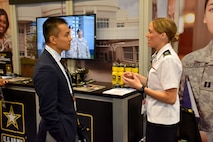 Capt. Emily Burris, clinical psychology resident with Brooke Army Medical Center, speaks with an attendee of the American Psychological Association 2018 Convention at the Moscone Center in San Francisco, California on August 9. Burris was on hand with Soldiers from the San Francisco Medical Recruiting Station to explain the benefits and opportunities of a career in Army Medicine. For more information on the Army's more than 90 medical specialties go to healthcare.goarmy.com.
