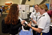 Staff Sgt. Shanna M. Rodriguez, health care recruiter with the San Francisco Medical Recruiting Station, scans a QR code of an attendee of the American Psychological Association 2018 Convention at the Moscone Center in San Francisco, California on August 9. Rodriguez and Capt. Emily Burris, clinical psychology resident with Brooke Army Medical Center, with were on hand with explain the benefits and opportunities of a career in Army Medicine. For more information on the Army's more than 90 medical specialties go to healthcare.goarmy.com.