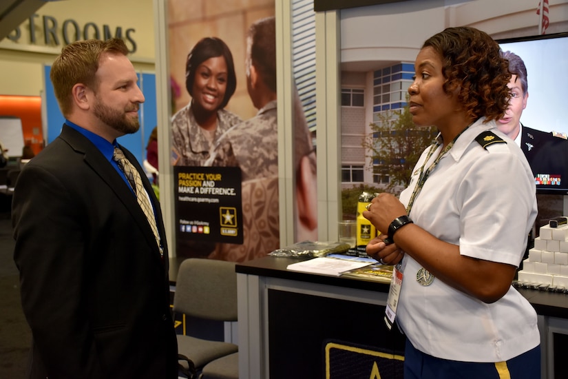 Maj. Lakishia M. Simmons, San Francisco Medical Recruiting Station officer-in-charge, speaks with an attendee of the American Psychological Association 2018 Convention at the Moscone Center in San Francisco, California on August 9. Simmons was on hand with her team to explain the benefits and opportunities of a career in Army Medicine. For more information on the Army's more than 90 medical specialties go to healthcare.goarmy.com.