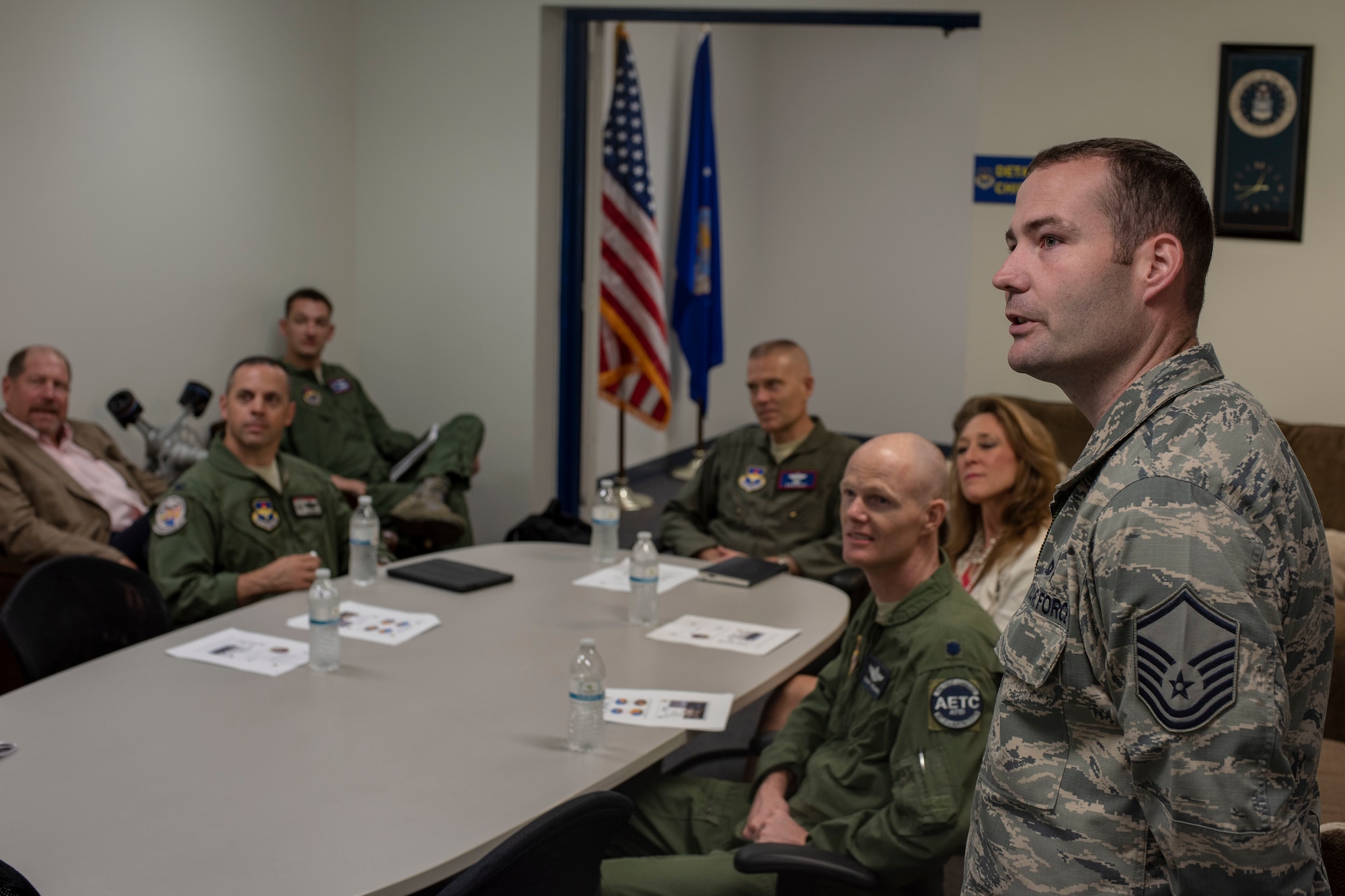 U.S. Air Force Master Sgt. Jon Adams, the 372nd Training Squadron, Detachment 23 chief, briefs Lt. Gen. Steven Kwast, commander of Air Education and Training Command, on the detachment’s current processes at Misawa Air Base, Japan, Aug. 6, 2018. Adams informed Kwast of his unit’s daily operations in order to give him a better understanding of their procedures and mission. Kwast’s visit also increased bilateral coordination for the F-35 Lightning II program as well as reaffirmed AETC’s training and support roles in the region. (U.S. Air Force photo by Airman 1st Class Collette Brooks)