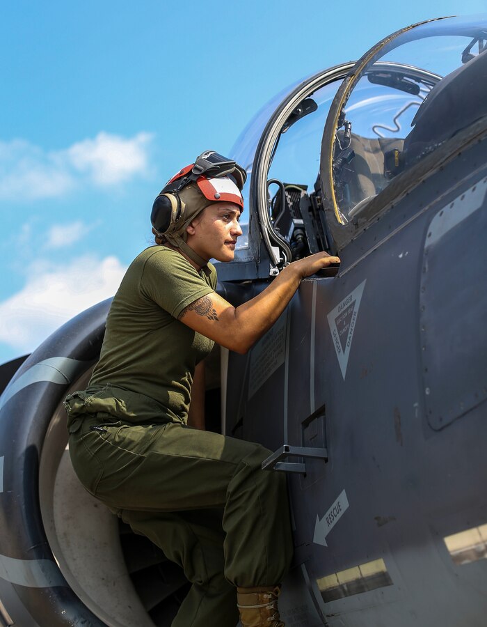 Lance Cpl. Hannah Crook, a Marine Attack Squadron (VMA) 311 aviation ordnance Marine, performs post-flight maintenance checks on an AV-8B Harrier II during Exercise Northern Lightning at Volk Field Counterland Training Center, Camp Douglas, Wis. Aug. 13. Exercise Northern Lightning 2018 allows the Air Force, Marine Corps and Navy to strengthen interoperability between services and gives the different branches a greater understanding of aviation capabilities within a joint fighting force. (U.S. Marine Corps photo by Sgt. David Bickel)