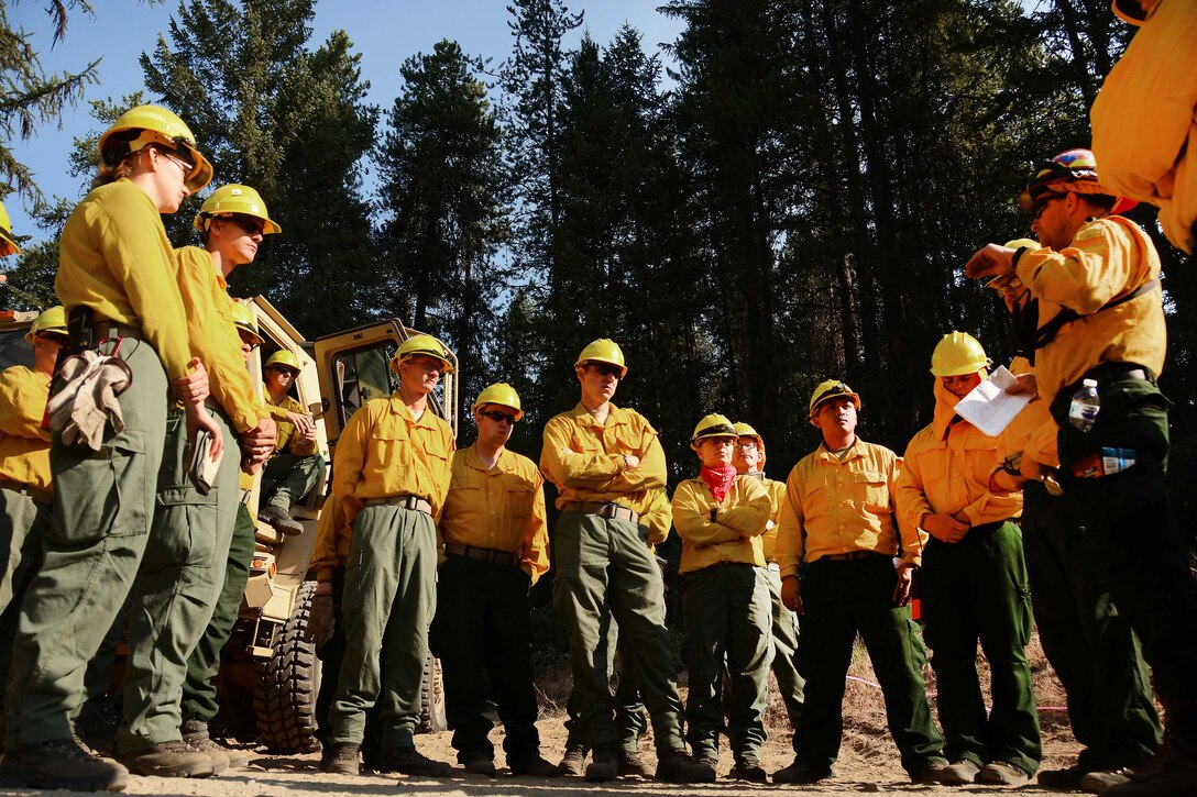 Soldiers receive a safety brief before conducting firefighting operations.