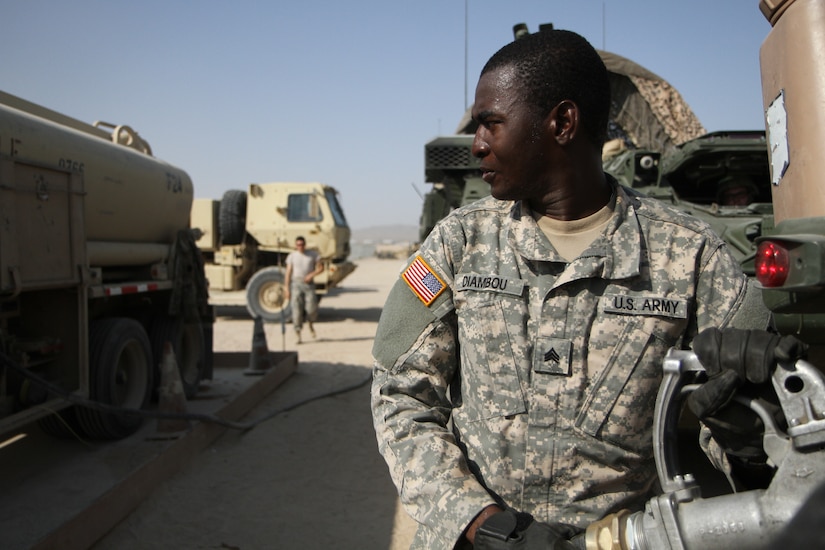 Army Sgt. Siaka Diambou, a motor transport operator for the Pennsylvania Army National Guard’s 1067th Composite Truck Company, fuels a Stryker Interim Armored Vehicle at the National Training Center at Fort Irwin, Calif., July 31, 2018. Pennsylvania Army National Guard photo by Sgt. Claire A. Charles