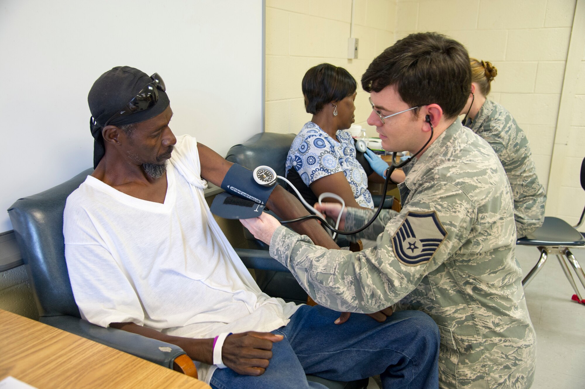 U.S. Air Force Master Sgt. Matthew Stickley a medical technician with the West Virginia’s Air National Guard’s 167th Medical Group, Martinsburg, W.Va., conducts an initial health screening with local residents in Millen, Ga., July 14, 2018, during the East Central Georgia Innovative Readiness Training. An IRT provides hands-on, real-world training to improve readiness and interoperability for service members in complex contingency environments while providing key services for American communities. (U.S. Air Force photo by Master Sgt. Theanne Herrmann)