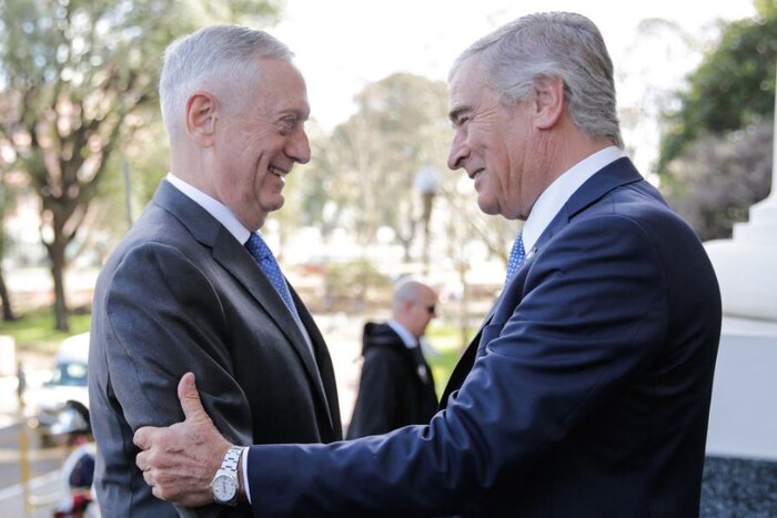 Defense Secretary James N. Mattis embraces Argentinian Defense Minister Oscar Aguad.