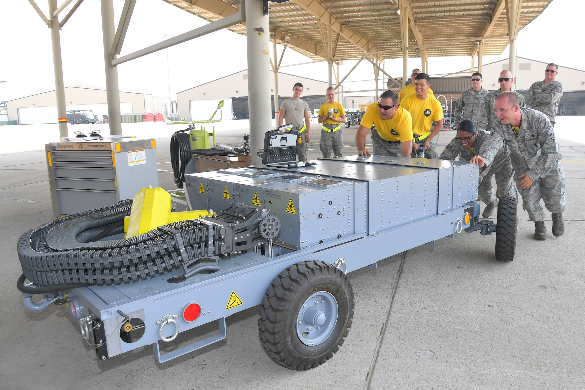 For the first time, maintainers in the 4th Aircraft Maintenance Unit loaded the F-35A’s internal cannon with 25 mm rounds for operational training Aug. 10, 2018. (left to right) Staff Sgt. Karl Tesch, Airman Baltazar Enriquez, Airman 1st Class Emily Villela and Master Sgt. John Hughes, all  4th Aircraft Maintenance Unit, position an ammo cart to begin the first time load of 25mm target rounds in an F-35A Lightning II at Hill Air Force Base, Utah. (U.S. Air Force photo by Todd Cromar)