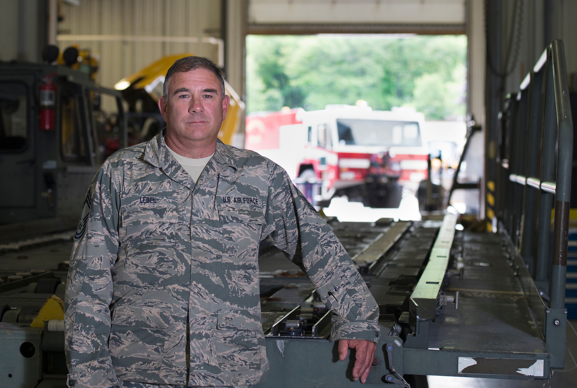 Chief Master Sgt. Anthony M. Lebel, the vehicle fleet manager assigned to the 157th Mission Support Group, poses for a portrait on July 26, 2018 at Pease Air National Guard Base, N.H. Lebel is scheduled to retire on August 11, 2018, after more than 35 years of service. (N.H. Air National Guard photo by Staff Sgt. Kayla White)
