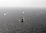 Guided-missile destroyer USS The Sullivans (DDG 68) leads a formation of ships, including Cyclone-class patrol crafts USS Tempest (PC 2) and USS Chinook (PC 9), U.S. Coast Guard Island-class patrol cutter USCGC Monomoy (WPB 1326), a Kuwaiti naval vessel and an Iraqi naval vessel during a trilateral exercise with Iraq and Kuwait. The exercise is a surface engagement between the U.S. Navy and Coast Guard, and the Iraqi and Kuwaiti navies focused on improving proficiency in maritime security tactics to help ensure the freedom of navigation throughout the U.S. 5th Fleet area of operations. (U.S. Navy Photo by MC2 Lucas Askew/Released)