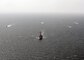 Guided-missile destroyer USS The Sullivans (DDG 68) leads a formation of ships, including Cyclone-class patrol crafts USS Tempest (PC 2) and USS Chinook (PC 9), U.S. Coast Guard Island-class patrol cutter USCGC Monomoy (WPB 1326), a Kuwaiti naval vessel and an Iraqi naval vessel during a trilateral exercise with Iraq and Kuwait. The exercise is a surface engagement between the U.S. Navy and Coast Guard, and the Iraqi and Kuwaiti navies focused on improving proficiency in maritime security tactics to help ensure the freedom of navigation throughout the U.S. 5th Fleet area of operations. (U.S. Navy Photo by MC2 Lucas Askew/Released)