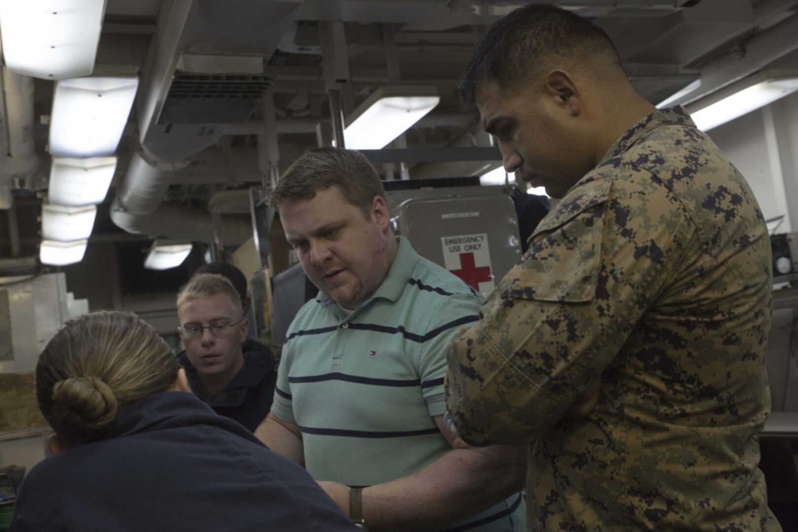 Sam Pratt, an engineer with Naval Sea Systems Command, discusses the capabilities of 3-D printing with service members aboard the USS Wasp (LHD-1) while underway in the Pacific Ocean, April 7, 2018. Marines with Combat Logistics Battalion 31, 31st Marine Expeditionary Unit, are now capable of ~additive manufacturing, also known as 3-D printing, which is the technique of replicating digital 3-D models as tangible objects. The 31st MEU partners with the Navy's Amphibious Squadron 11 to form the Wasp Amphibious Ready Group, a cohesive blue-green team capable of accomplishing a variety of missions across the Indo-Pacific.