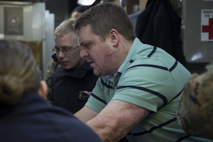 Sam Pratt, an engineer with Naval Sea Systems Command, discusses the capabilities of 3-D printing with service members aboard the USS Wasp (LHD-1) while underway in the Pacific Ocean, April 7, 2018. Marines with Combat Logistics Battalion 31, 31st Marine Expeditionary Unit, are now capable of ~additive manufacturing,™ also known as 3-D printing, which is the technique of replicating digital 3-D models as tangible objects. The 31st MEU partners with the Navy™s Amphibious Squadron 11 to form the Wasp Amphibious Ready Group, a cohesive blue-green team capable of accomplishing a variety of missions across the Indo-Pacific.