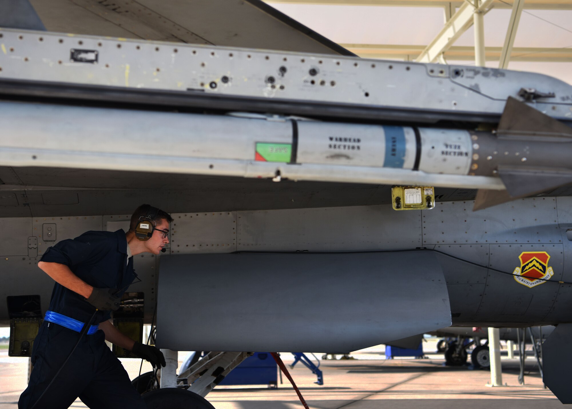 U.S Air Force Airman Luke Prokop, 309th Aircraft Maintenance Unit crew chief, performs final safety checks on an F-16 Fighting Falcon, Aug. 14, 2018 at Luke Air Force Base, Ariz.