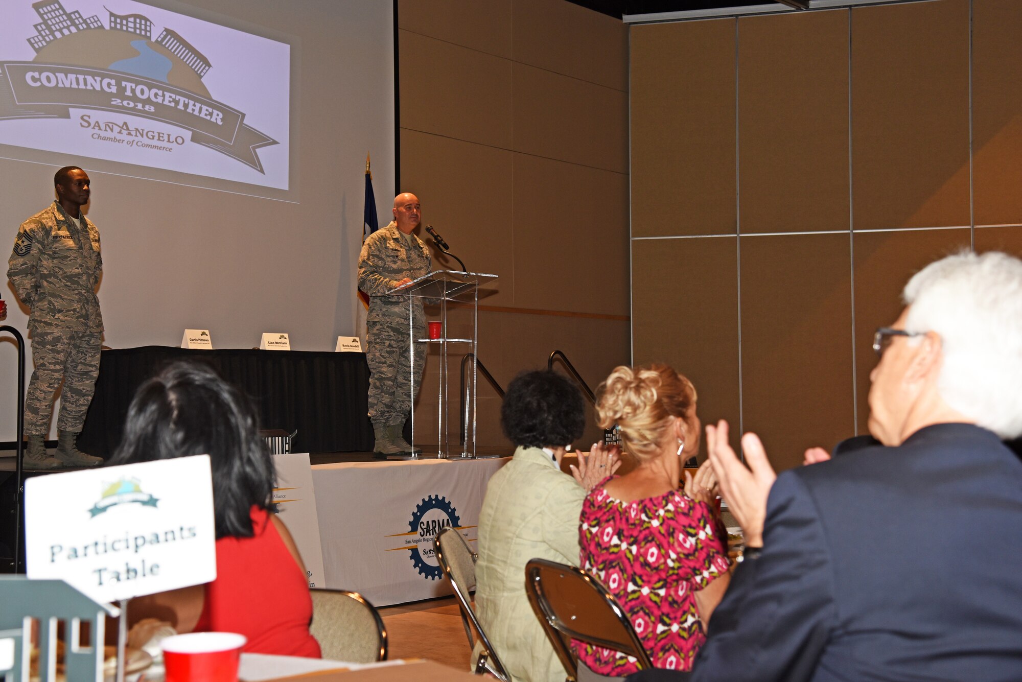 U.S. Air Force Col. Robert Ramirez, 17th Training Wing vice commander, speaks during a San Angelo Chamber of Commerce luncheon at the McNease Convention Center in San Angelo, Texas, Aug. 14, 2018. Ramirez express excitement to be stationed at Goodfellow Air Force Base for the third time in his career. (U.S. Air Force photo by Staff Sgt. Joshua Edwards/Released)
