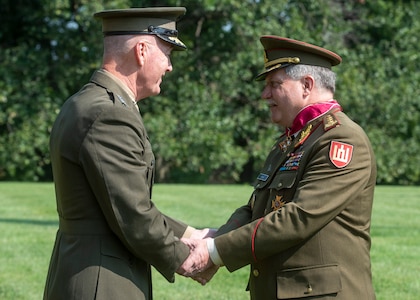 Chairman of the Joint Chiefs of Staff Gen. Joseph F. Dunford, Jr., hosts his Lithuanian counterpart Lt. Gen. Jonas Vytautas Žukas for an honors ceremony on Whipple Field at Fort Myer, in Washington D.C., Aug. 15, 2018. During the ceremony Dunfored presented Žukas with a Legion of Merit award for service to his country. (DOD Photo by Navy Petty Officer 1st Class Dominique A. Pineiro)