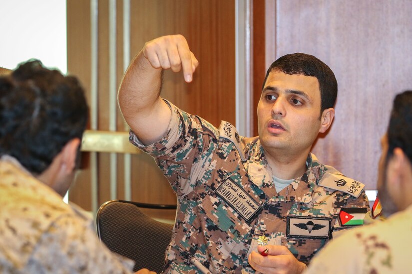 Maj. Mohammad Alsinglawi, a staff artillery officer for the Jordanian Armed Forces Field Artillery Corps Command, participates in a table-top artillery exercise with partner nations at the Regional Artillery Symposium in Nashville, Tenn., Aug. 9, 2018. The symposium enhanced the interoperability and cooperation of regional partners by creating an open forum for partner nations to discuss field artillery operations, tactical planning and execution methodologies in order to strategically develop the use of artillery assets in the U.S. Army Central area of operations.