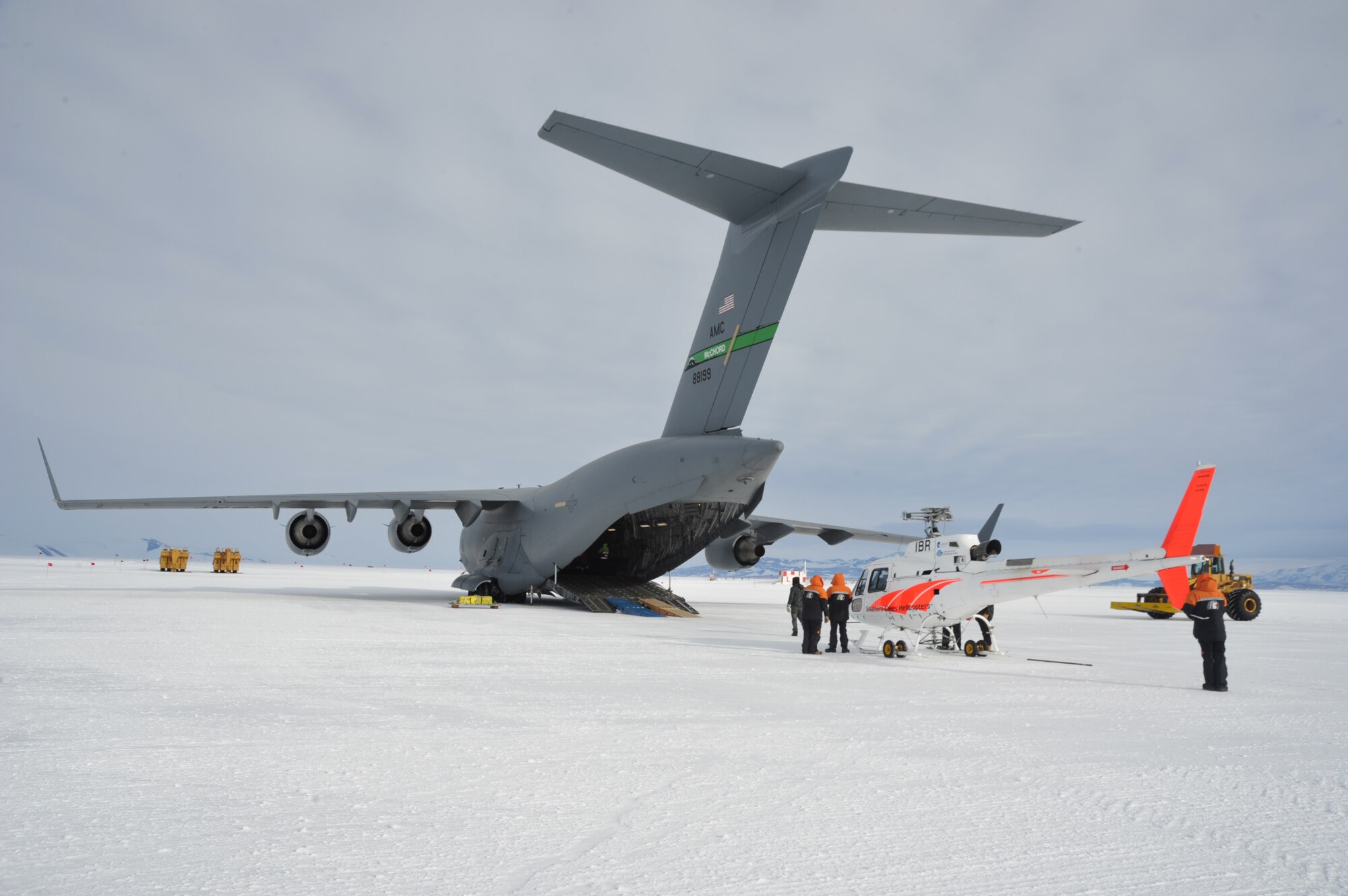 A Bell 212, operated by Antarctic New Zealand, is prepared to be loaded onto a C-17 Globemaster III Feb. 17, 2018 near McMurdo Station in Antarctica. Members of the 304th Expeditionary Airlift Squadron operated aircraft while supporting the U.S. Antarctic Program through Operation Deep Freeze. (Courtesy Photo)