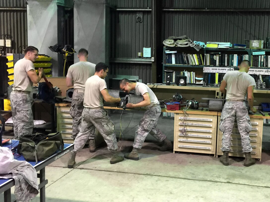 U.S. Airmen assigned to the 51st Civil Engineer Squadron heating, ventilating and air conditioning flight work on daily tasks in their shop at Osan Air Base, Republic of Korea, July 30, 2018. Throughout the summer, HVAC Airmen routinely work in temperatures above 100 degrees to ensure base residents have functioning air conditioning in their areas of rest and relaxation. (Courtesy photo by Master Sgt. Michael Holmes)