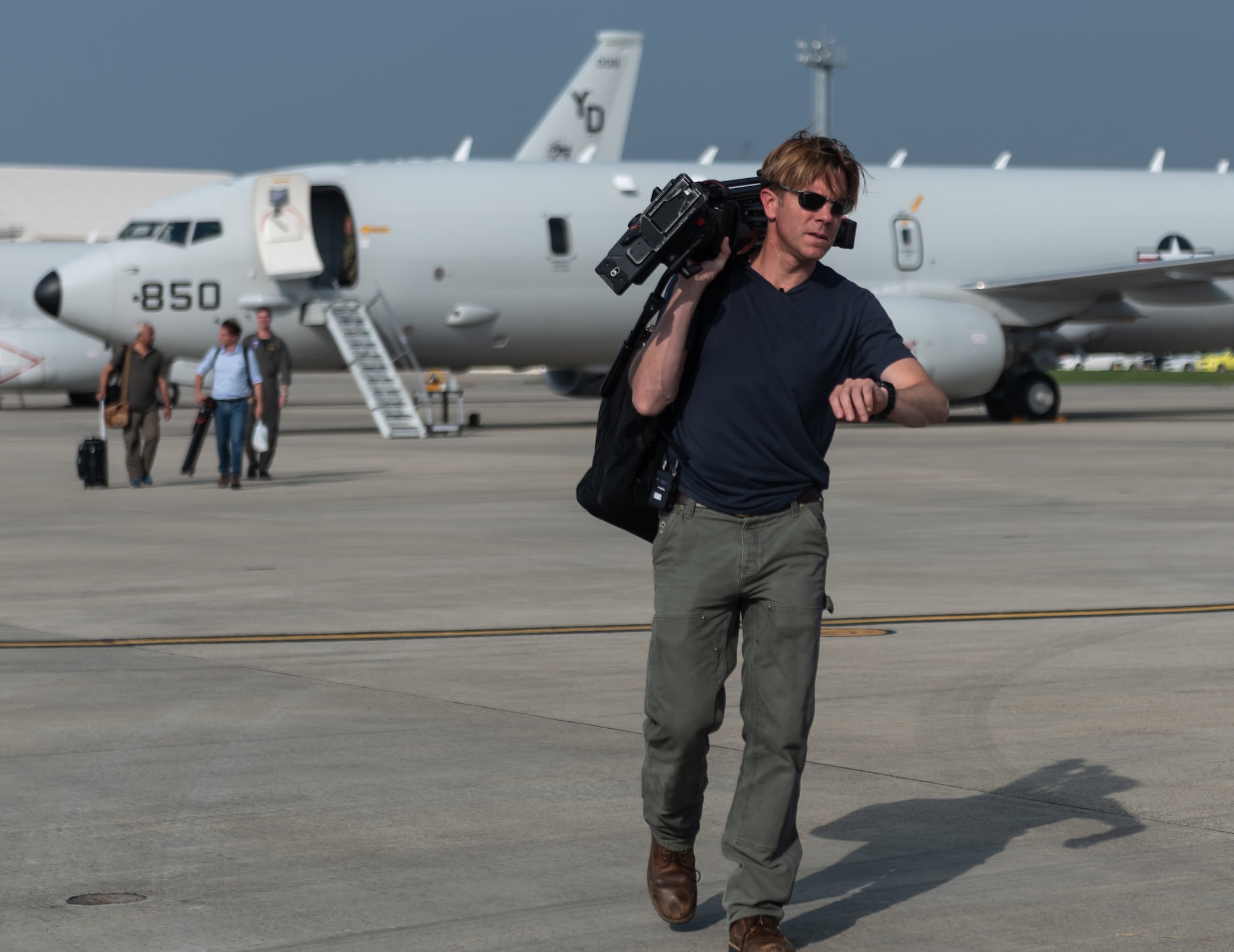 CNN Reporter Ivan Watson prepares to go live after flying on a U.S. Navy P-8A Poseidon Aug. 10, 2018, at Kadena Air Base, Japan. The Poseidon is a maritime patrol and reconnaissance aircraft designed to improve an operator’s ability to conduct anti-submarine warfare, anti surface warfare, and intelligence, surveillance, and reconnaissance missions. (U.S. Air Force photo by Staff Sgt. Micaiah Anthony)