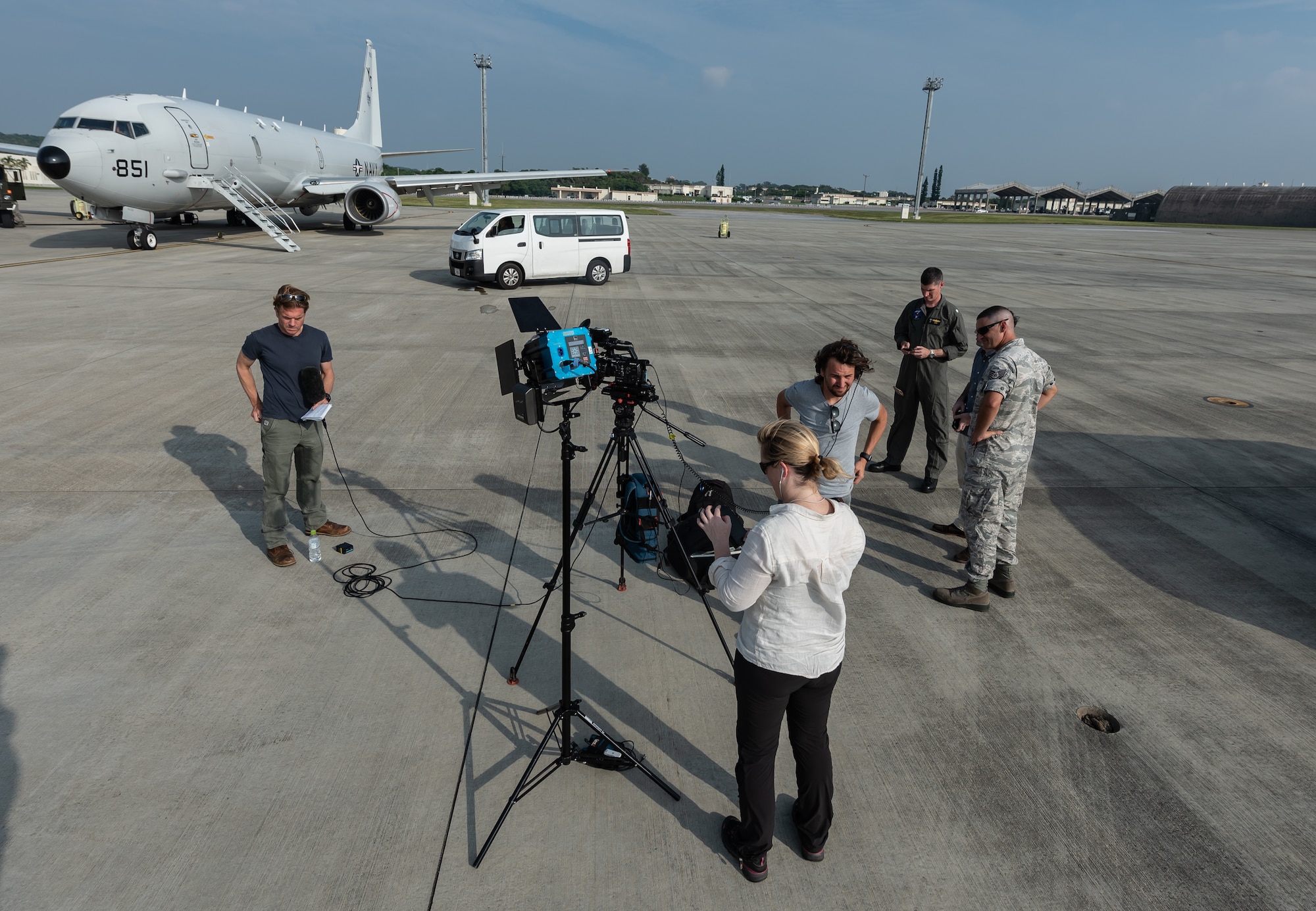 A news team from CNN prepares to go live after a flight on a U.S. Navy P-8A Poseidon Aug. 10, 2018, at Kadena Air Base, Japan. News agencies were invited to fly on the P-8A to learn about the Poseidon’s abilities and the role it plays in the Pacific region. (U.S. Air Force photo by Staff Sgt. Micaiah Anthony)