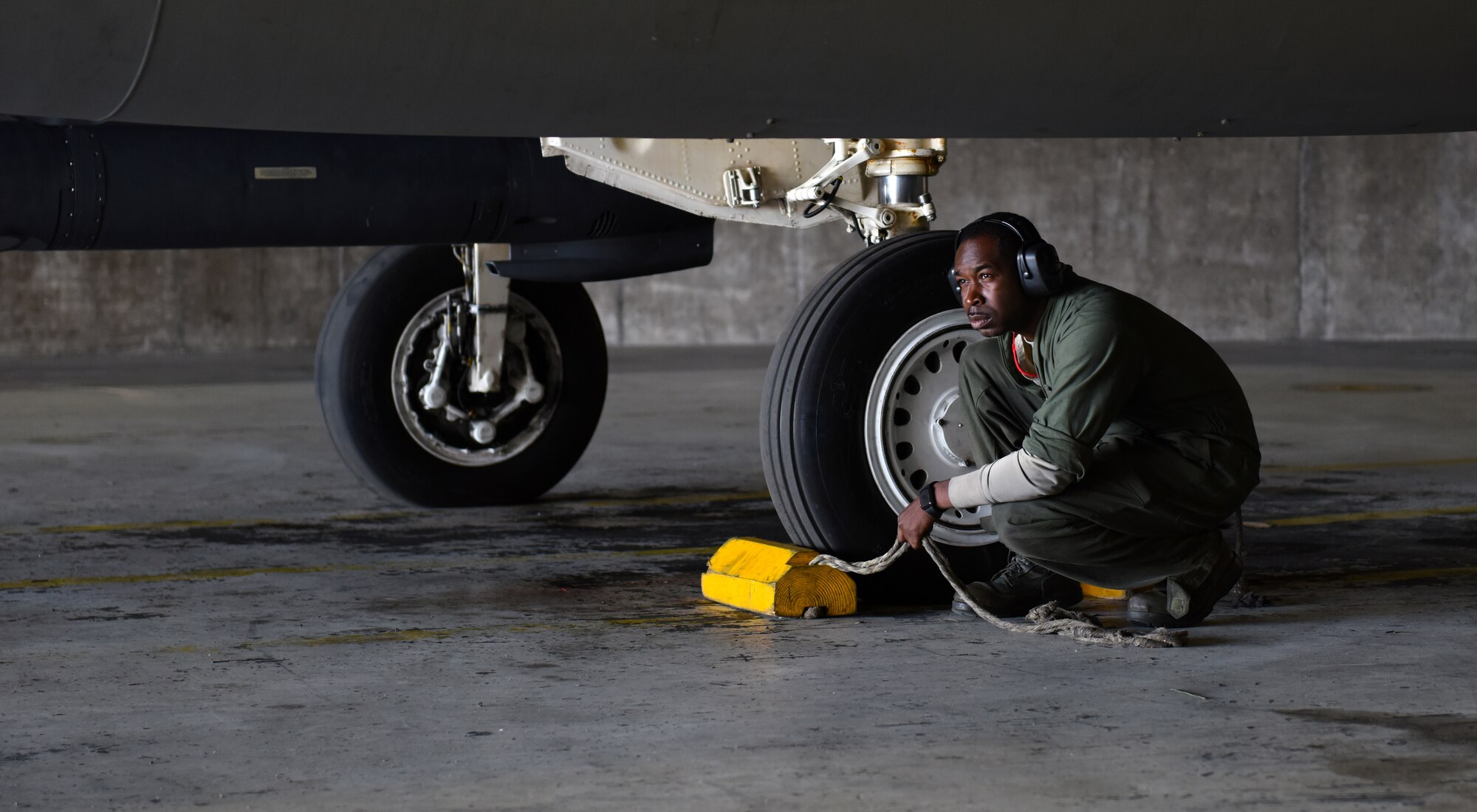 An Airman assigned to the 748th Aircraft Maintenance Squadron prepares to pull the chocks from an F-15C Eagle at Keflavik Air Base, Iceland, Aug. 1, 2018, in support of NATO’s Icelandic Air Surveillance mission. During IAS, the 748th AMXS Airmen are responsible for maintaining the four mission critical F-15s as well as 10 additional jets designated for training. (U.S. Air Force photo/Staff Sgt. Alex Fox Echols III) (U.S. Air Force photo/Staff Sgt. Alex Fox Echols III)