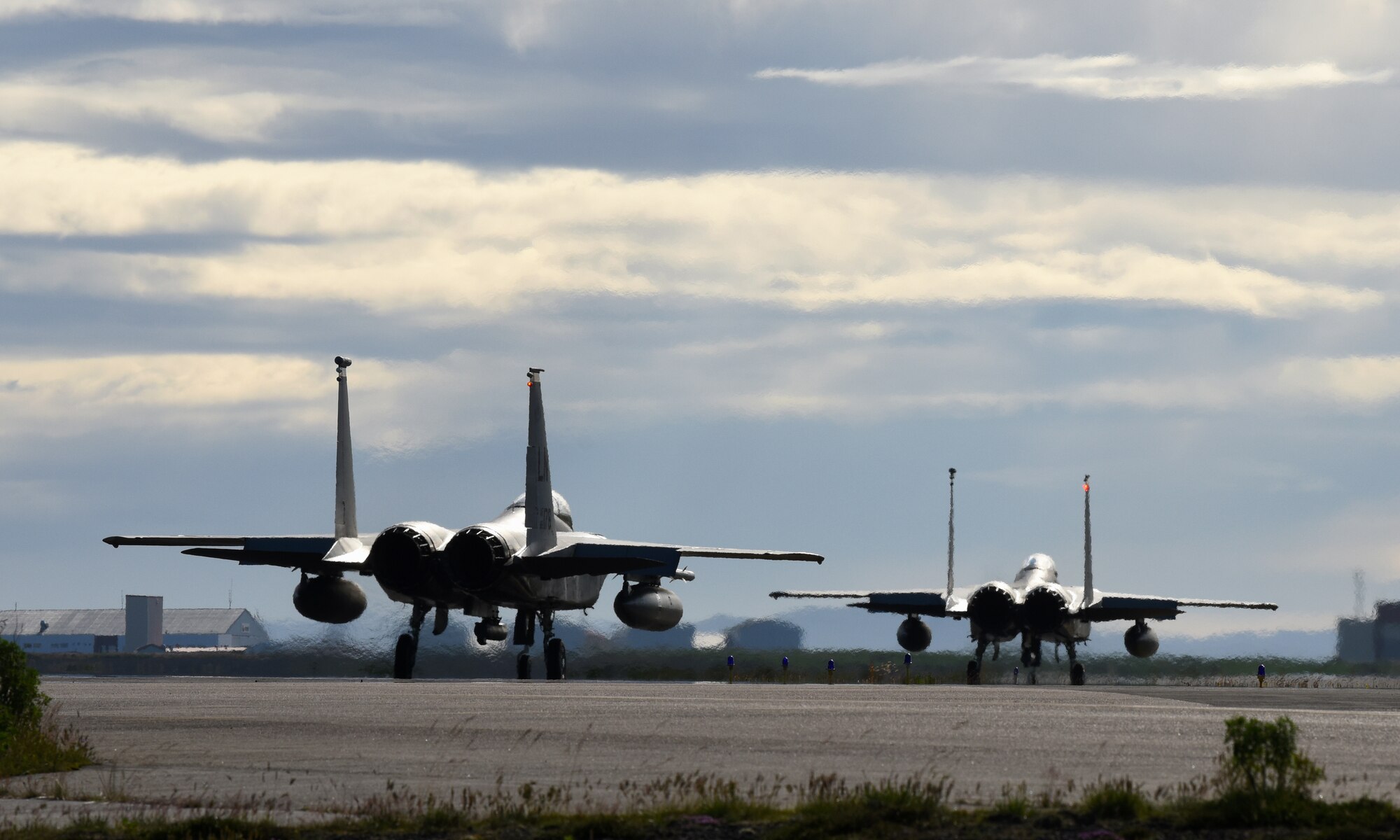 Two F-15C Eagles assigned to the 493rd Expeditionary Fighter Squadron taxi on the flightline at Keflavik Air Base, Iceland, Aug. 6, 2018, in support of NATO’s Icelandic Air Surveillance mission. While providing critical infrastructure and support, Iceland has looked to its NATO allies to provide airborne surveillance and interception capabilities to meet its peacetime preparedness needs since 2008. (U.S. Air Force photo/Staff Sgt. Alex Fox Echols III)