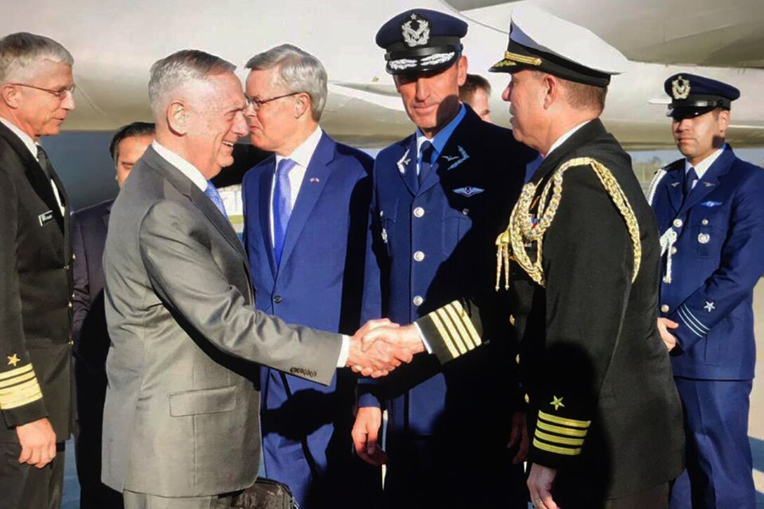 Defense Secretary James N. Mattis shakes hands with a Chilean military official in Santiago.