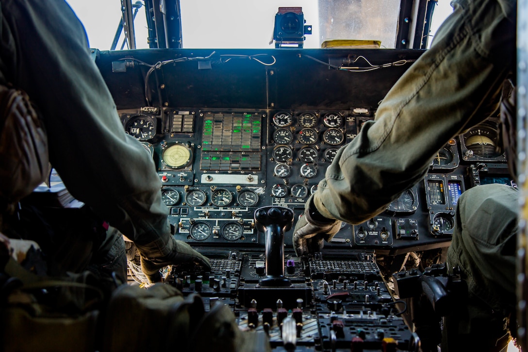 Capt. David Skaggs, left, and Capt. Patrick McGuire, CH-53E Super Stallion pilots with Marine Heavy Helicopter Squadron 465, Marine Aircraft Group 16, 3rd Marine Aircraft Wing, conduct preflight checks at Marine Corps Air Station Miramar, Calif., Aug. 10. HMH-465 conducts training with Amphibious Raids Branch, Expeditionary Operations Training Group, I Marine Expeditionary Force, to assist infantry Marines performing fast-rope training from a helicopter.