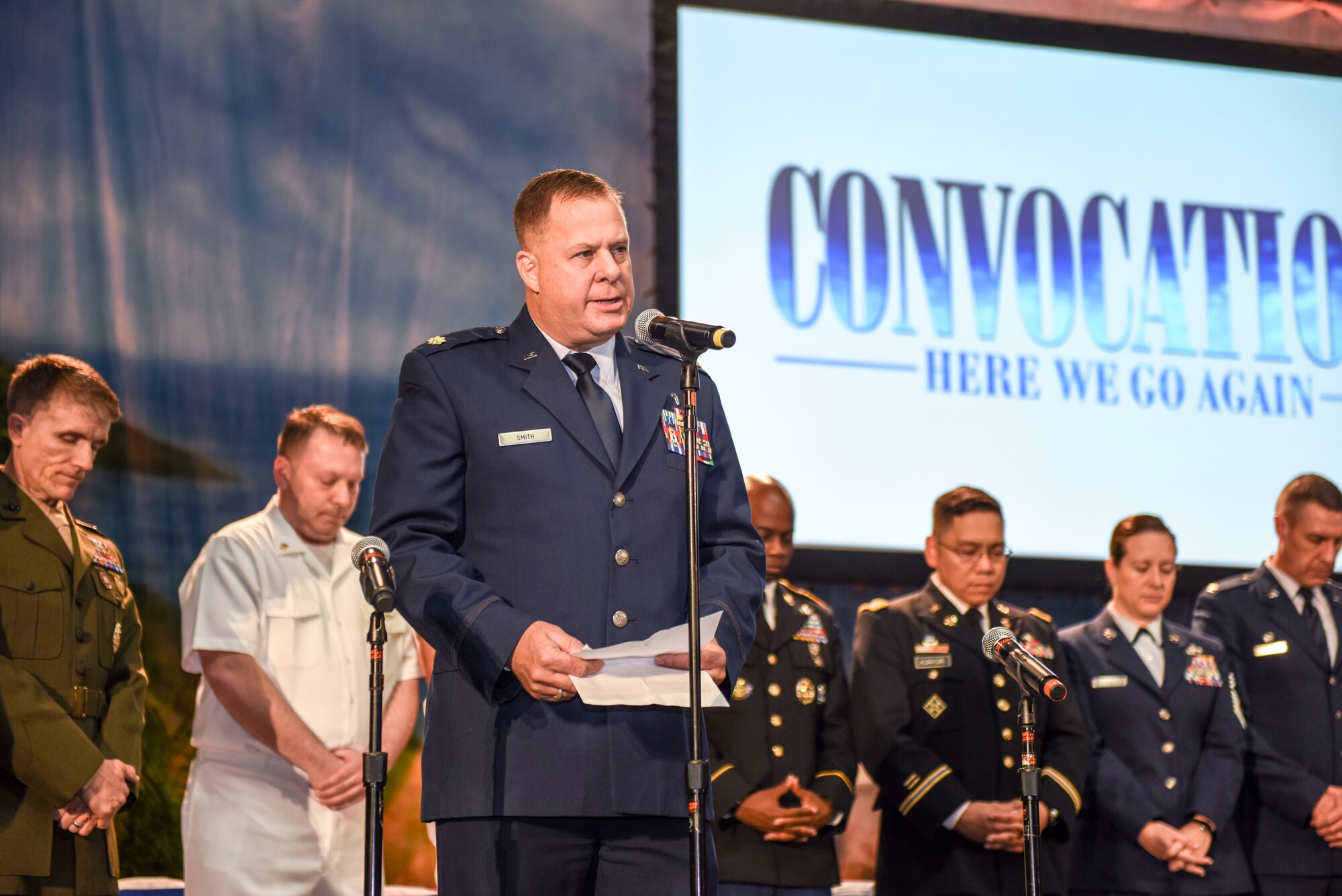 U.S. Air Force Maj. Melvin Smith, 17th Training Wing deputy wing chaplain, provides the invocation during the San Angelo Independent School District’s annual convocation at the Foster Communications Coliseum, San Angelo, Texas, Aug. 15, 2018. Leadership from each of the services represented Goodfellow during the event.  (U.S. Air Force photo by Aryn Lockhart/Released)