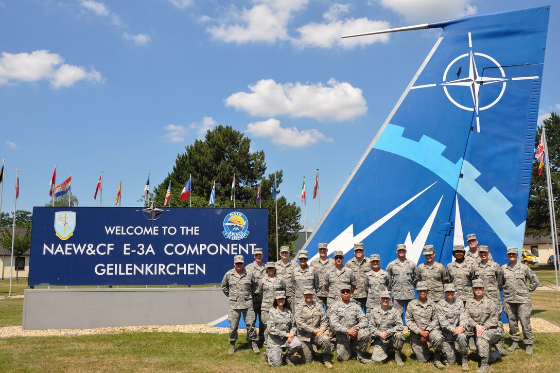 The 442d Medical Squadron poses for a photo in front of the welcome sign at NATO Air Base Geilenkirchen, Germany, June 28, 2018.