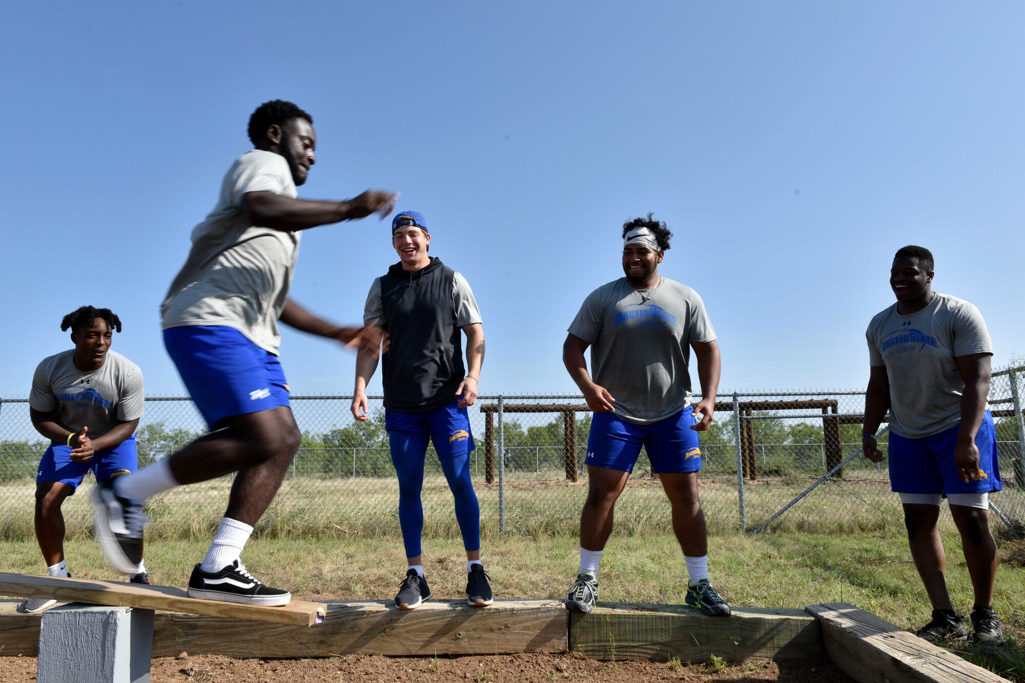 Angelo State University Student, Philip Mayfield, jumps a gap on the Kimbro’s Bridge obstacle on Goodfellow Air Force Base, Texas, Aug. 15, 2018. Goodfellow invited the ASU team not only to challenge themselves on the course, but also to give the students an insight into how the military builds teamwork. (U.S. Air Force photo by Senior Airman Randall Moose/Released)