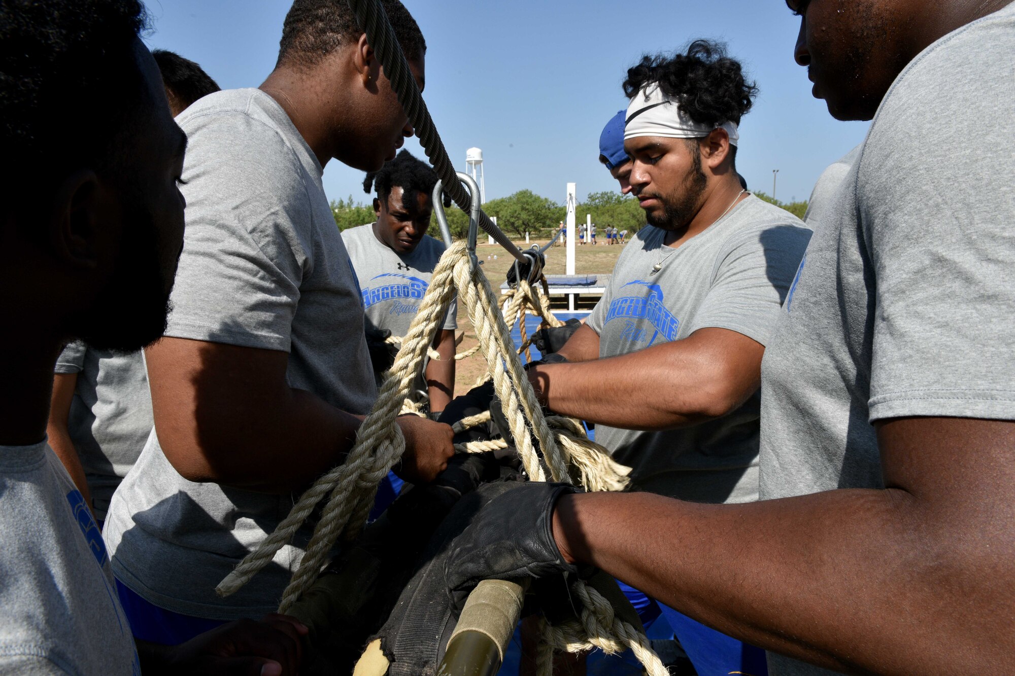 Angelo State University students attach a 200-pound litter to a zip-line on the Kedenburg’s Extraction obstacle on Goodfellow Air Force, Texas, Aug, 15, 2018. The 344th Military Intelligence Battalion designed the course to facilitate team building and encourage critical thinking. (U.S. Air Force photo by Senior Airman Randall Moose/Released)