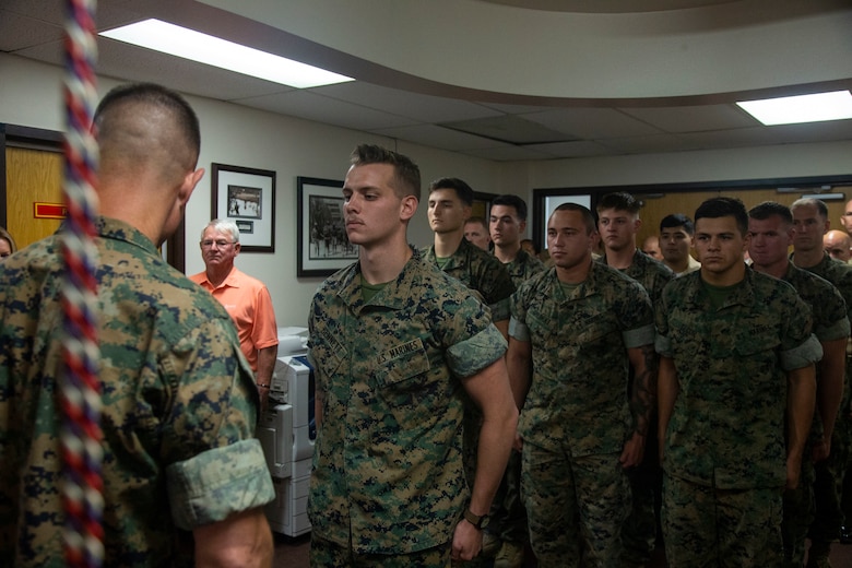 Lance Cpl. Dillon Bennett, machine gunner, 3rd Battalion, 7th Marine Regiment, receives a Purple Heart from Col. Kyle B. Ellison, commanding officer, 7th Marine Regiment, at 7th Marines' Headquarters aboard the Marine Corps Air Ground Combat Center, Twentynine Palms, Calif., July 27, 2018. Bennett received the Purple Heart for wounds sustained while deployed to his area of operations on July 9, 2018. (Marine Corps photo by Lance Cpl. Dave Flores)