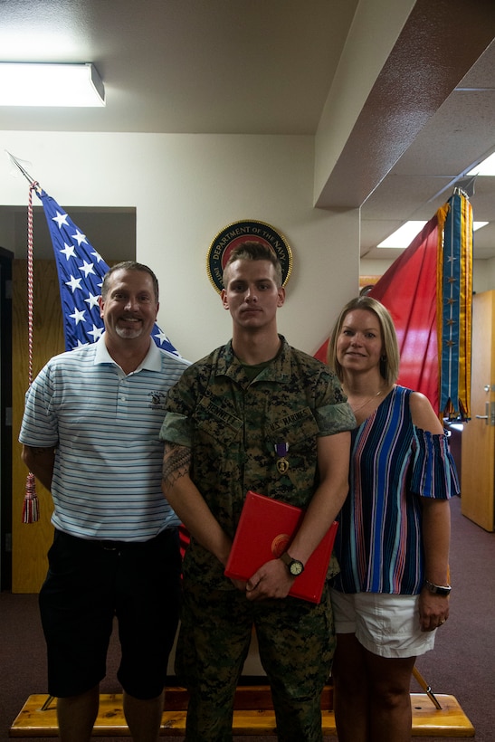 Lance Cpl. Dillon Bennett, machine gunner, 3rd Battalion, 7th Marine Regiment, received a Purple Heart from Col. Kyle B. Ellison, commanding officer, 7th Marine Regiment, at the 7th Marines’ Headquarters aboard the Marine Corps Air Ground Combat Center, Twentynine Palms, Calif., July 27, 2018. Bennett received the Purple Heart for wounds sustained while deployed to his area of operations on July 9, 2018. (Marine Corps photo by Lance Cpl. Dave Flores)