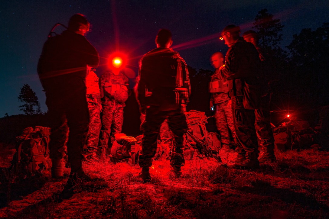 Marines talk in a circle.