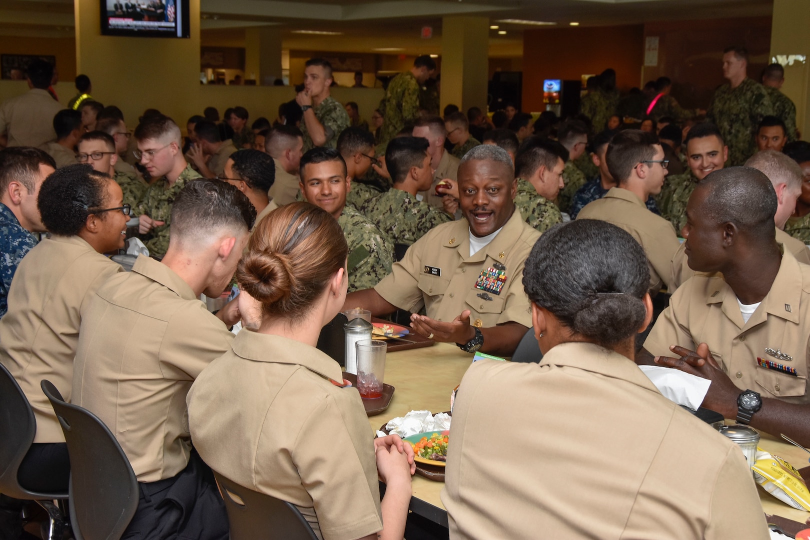 Force Master Chief Hosea Smith Jr., Hospital Corps director, eats lunch with Hospital Corpsman Basic students at a Joint Base San Antonio-Fort Sam Houston dining facility. Navy Medicine is a global health care network of 63,000 personnel that provides healthcare support to the U.S. Navy and Marine Corps personnel, veterans and their families in high operational tempo environments, expeditionary medical facilities, medical treatment facilities, hospitals, clinics, hospital ships and research units around the world.