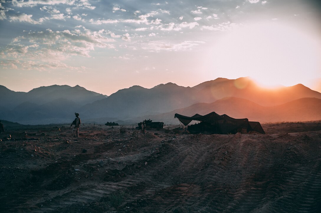 U.S. Marines with the 2nd Battalion, 23rd Marine Regiment dig into their defense during the Mobile Assault Course at Training Area Prospect as a part of Unit Deployment Program 19.1 aboard the Marine Corps Air Ground Combat Center, Twentynine Palms, Calif., Aug. 9, 2018. The purpose of UDP 19.1 is to sharpen technical and tactical skills and enhance unit cohesion to ensure mission success. (U.S. Marine Corps photo by Lance Cpl. William Chockey)