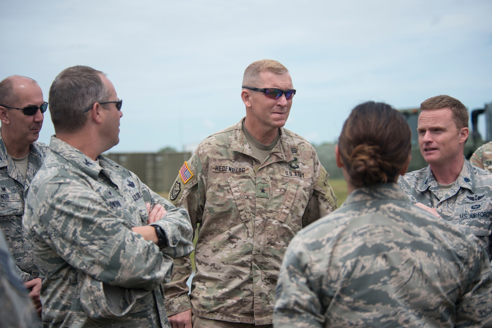 Connecticut Army and Air National Guard senior leaders discuss the AN/TYQ-23A Tactical Air Oper-ations Module (TAOM). Senior leaders pictured (from left to right), Col. Bill Neri, 103rd Mission Support Group Commander, Col. Stephen Gwinn, 103rd Airlift Wing Commander, Brig. Gen. Ralph Hedenberg, Connecticut National Guard Director Joint Staff, and Lt. Col. John Sorgini, 103rd Air Control Squadron Commander. (Air National Guard photos by Tech. Sgt. Tamara R. Dabney)