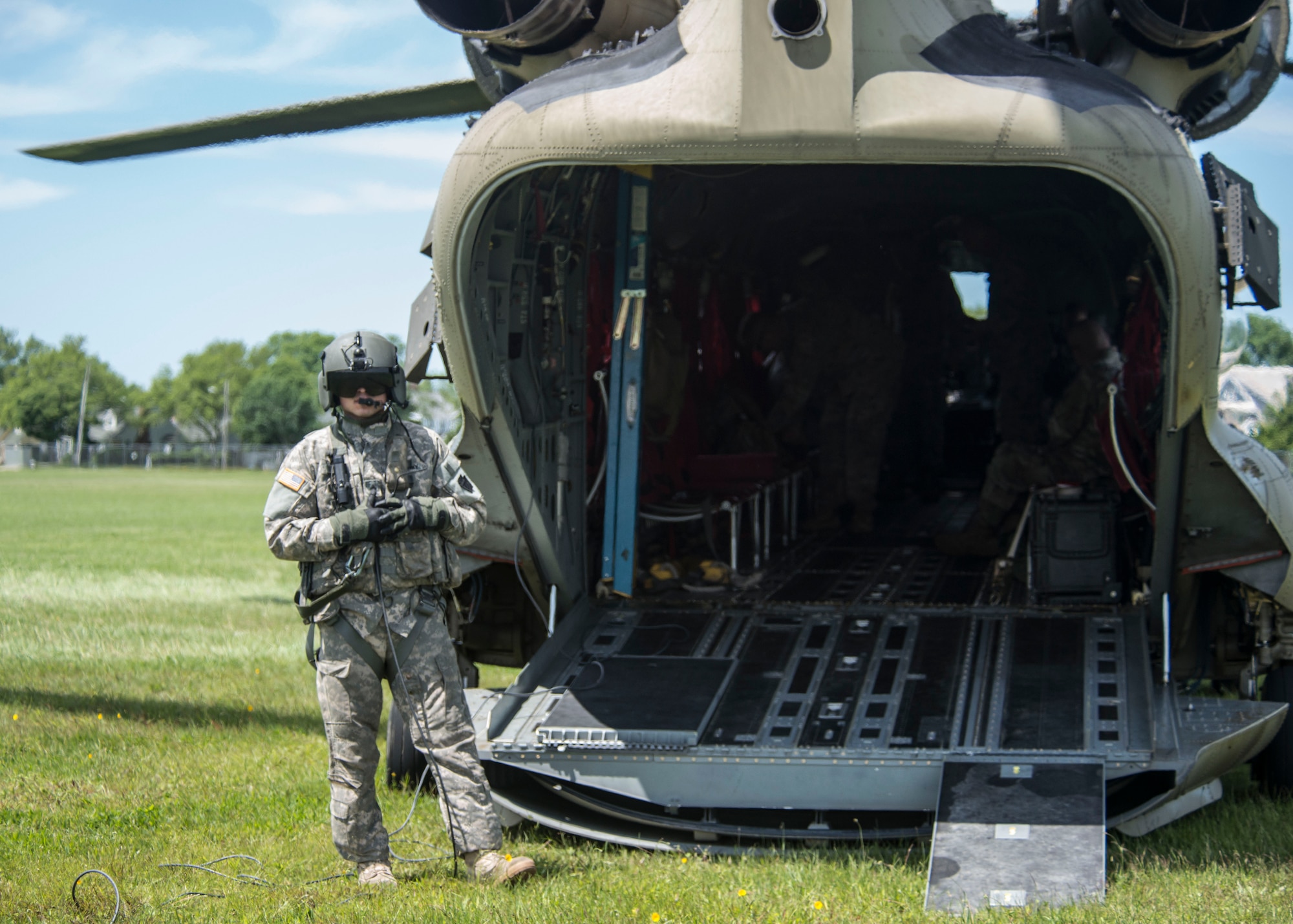 A Connecticut Army National Guard aviation specialist prepares to usher passengers onto a CH-47 Chinook during an annual training exercise, June 11, 2018 in Sea Girt, N.J. (Air National Guard photo by Tech. Sgt. Tamara R. Dabney)
