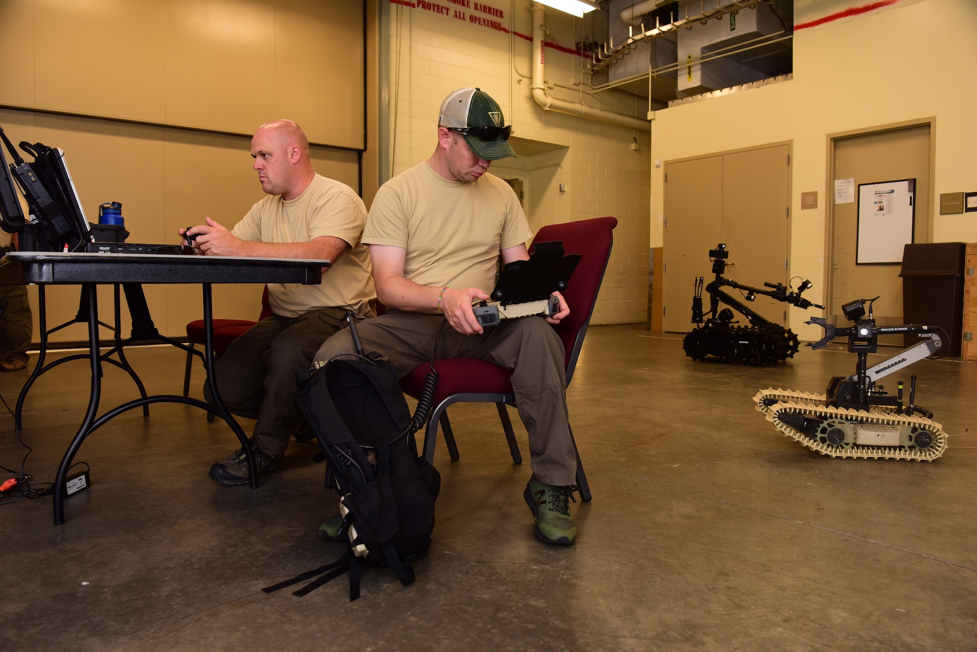 Mike Ward, left, New Jersey State Police Bomb Unit detective, and Joe Byra, NJSP detective, operate ordnance disposal robots during the 2018 Eastern National Robotics Rodeo at the at the Charleston convention center in Charleston S.C. Aug. 13, 2018, in Charleston, S.C.