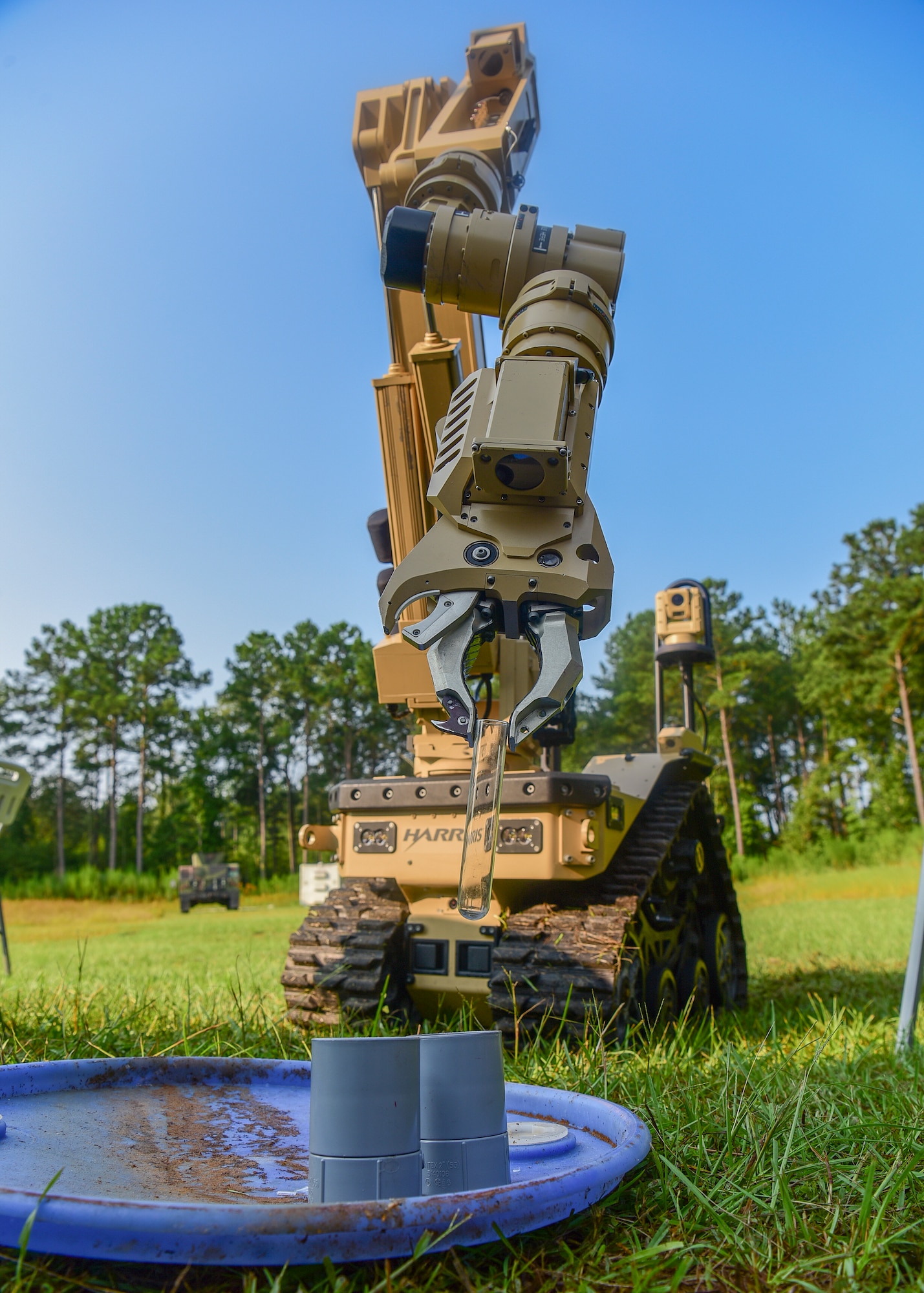 The Harris T7, a remotely operated ordnance disposal robot, places a glass vile into a holder during a demonstration at the 2018 Eastern National Robotics Rodeo Aug. 14, 2018, at Joint Base Charleston, S.C.
