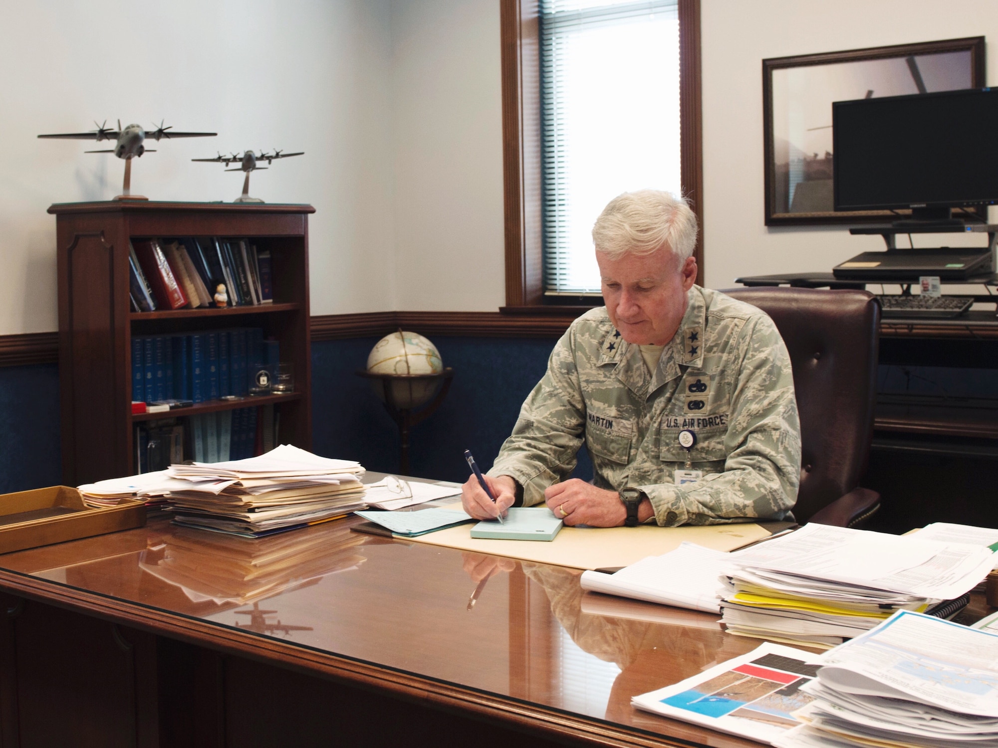 Maj. Gen. Thaddeus Martin works at his desk during his last week as the Connecticut National Guard The Adjutant General (TAG), June 27, 2018 in Hartford, Conn. He led the state for the past 13 years, and relinquished his command July 7, 2018. (U.S. Air National Guard photo by 1st Lt. Jen Pierce)