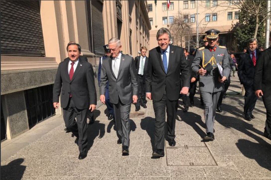 Defense Secretary James N. Mattis walks with Chilean Defense Minister Alberto Espina.