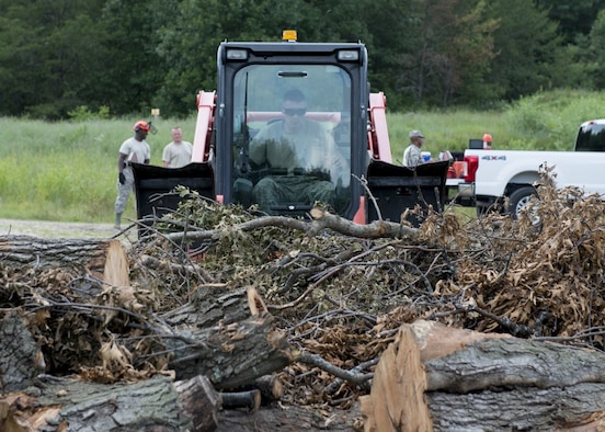 Senior Airman Alexander Thaxton uses a forklift to clear debris from a dirt road Sunday, July 15, 2018 as part of the PATRIOT North 18 exercise, at Volk Field Air National Guard Base, Wis. PATRIOT North 18 is an annual joint training exercise that tests the interoperability of military and civilian agencies. (Air National Guard photo by Tech. Sgt. Tamara R. Dabney)