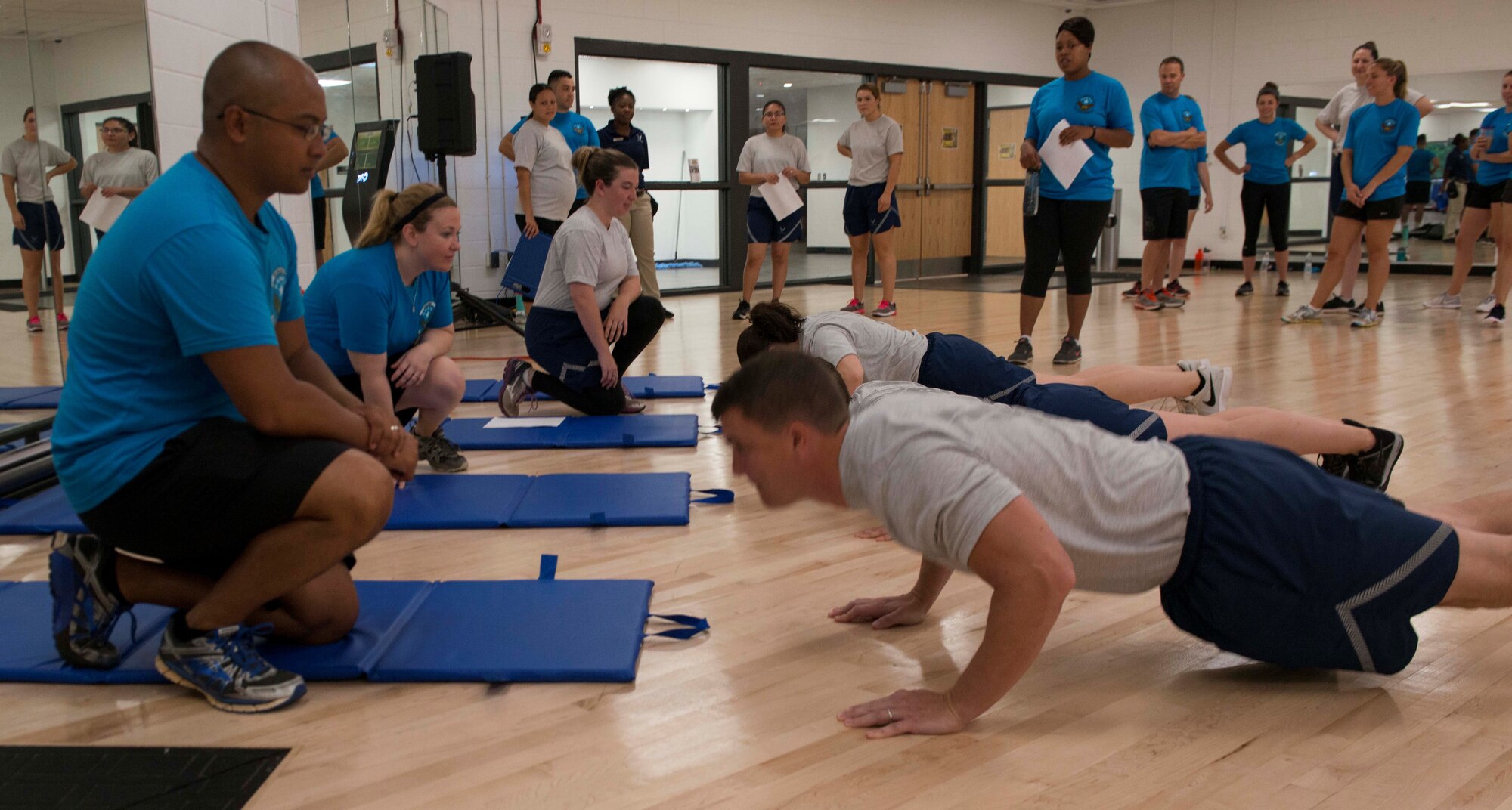 Members of the 51st Intelligence Squadron (IS) perform pushups at Shaw Air Force Base, S.C., Aug. 15, 2018.