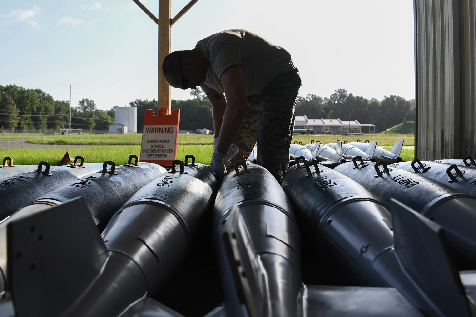 Munitions specialists assigned to the 307th Maintenance Squadron and 910th MXS train to handle, transport and store Bomb Dispenser Unit-50 low drags at the 307th MXS munitions storage facility on Barksdale Air Force Base, La., August 16, 2018. (U.S. Air Force photo by Airman 1st Class Maxwell Daigle/Released)