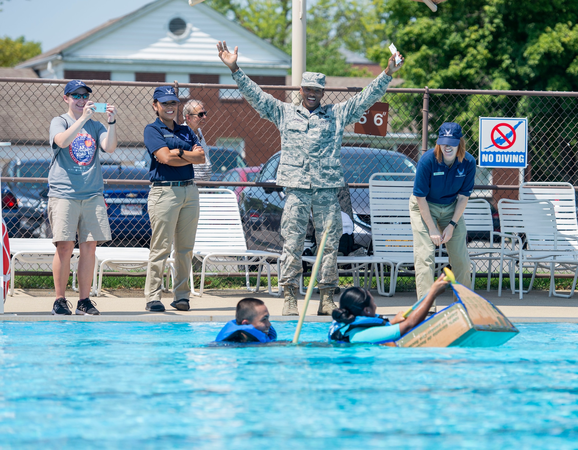 Staff Sgt. Kenneth LaGarde, 375th Force Support Squadron,cheers on members of the 375th FSS as they sink.