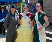 Col. Leslie Maher, 375th Air Mobility Wing commander, congratulates Airman 1st Class Tara Stetler, 375th AMW Public Affairs photojournalist, and Airman 1st Class Kylie Walker, 375th AMW PA broadcast journalist.
